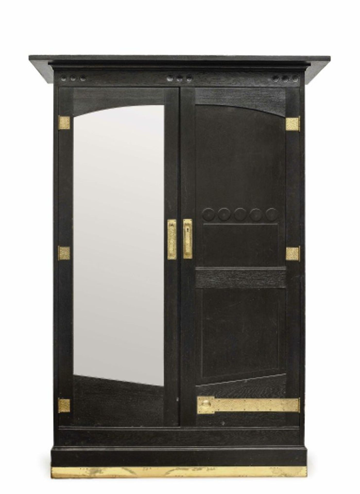 A cupboardVienna, 1905/1910 Oak, black stained. A door with mirror. Hammered brass fittings. Key