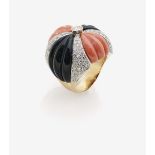 An Onyx, Coral and Diamond RingItaly 14K yellow gold (585/-), stamped. Circa 117 brilliant-cut