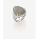 A Moonstone and Diamond Ring18K white gold, stamped. 50 small, brilliant-cut diamonds, altogether