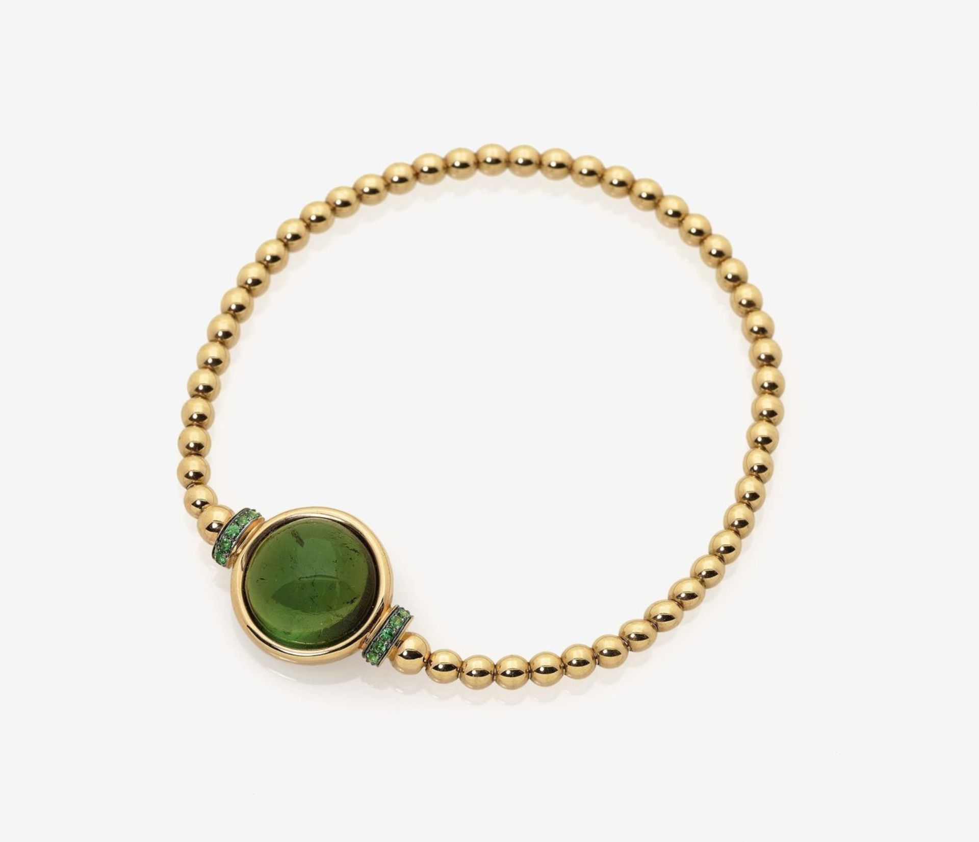 A Tourmaline set Bracelet18K yellow gold (750/-), stamped. 1 green tourmaline cabochon of circa 8.