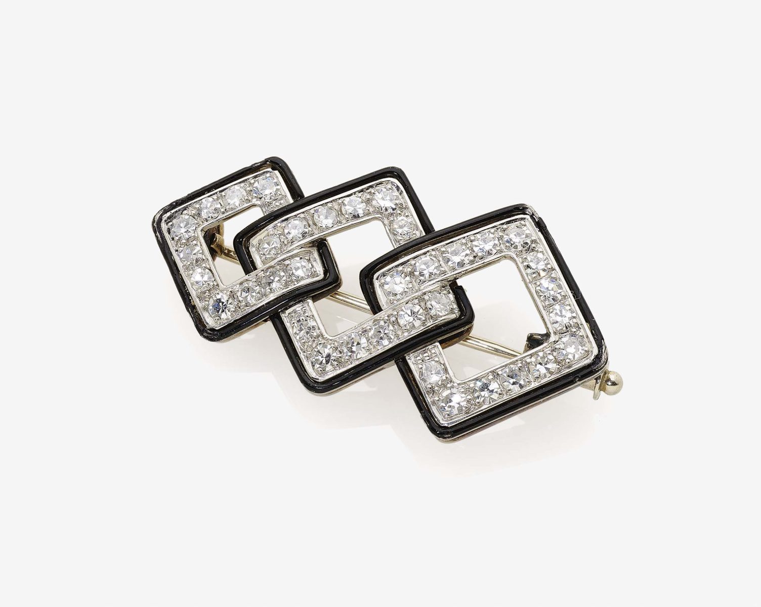 A Black Enamel and Diamond BroochFrance, 1920s Platinum, tested. 36 octagonal-cut diamonds,