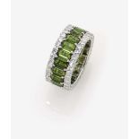 A Diamond and Tourmaline Eternity RingGermany 18K white gold (750/-), stamped. 66 small, brilliant-