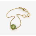 A Peridot and Emerald Bracelet18K yellow gold (750/-), stamped. Maker's marks. 1 brilliant-cut