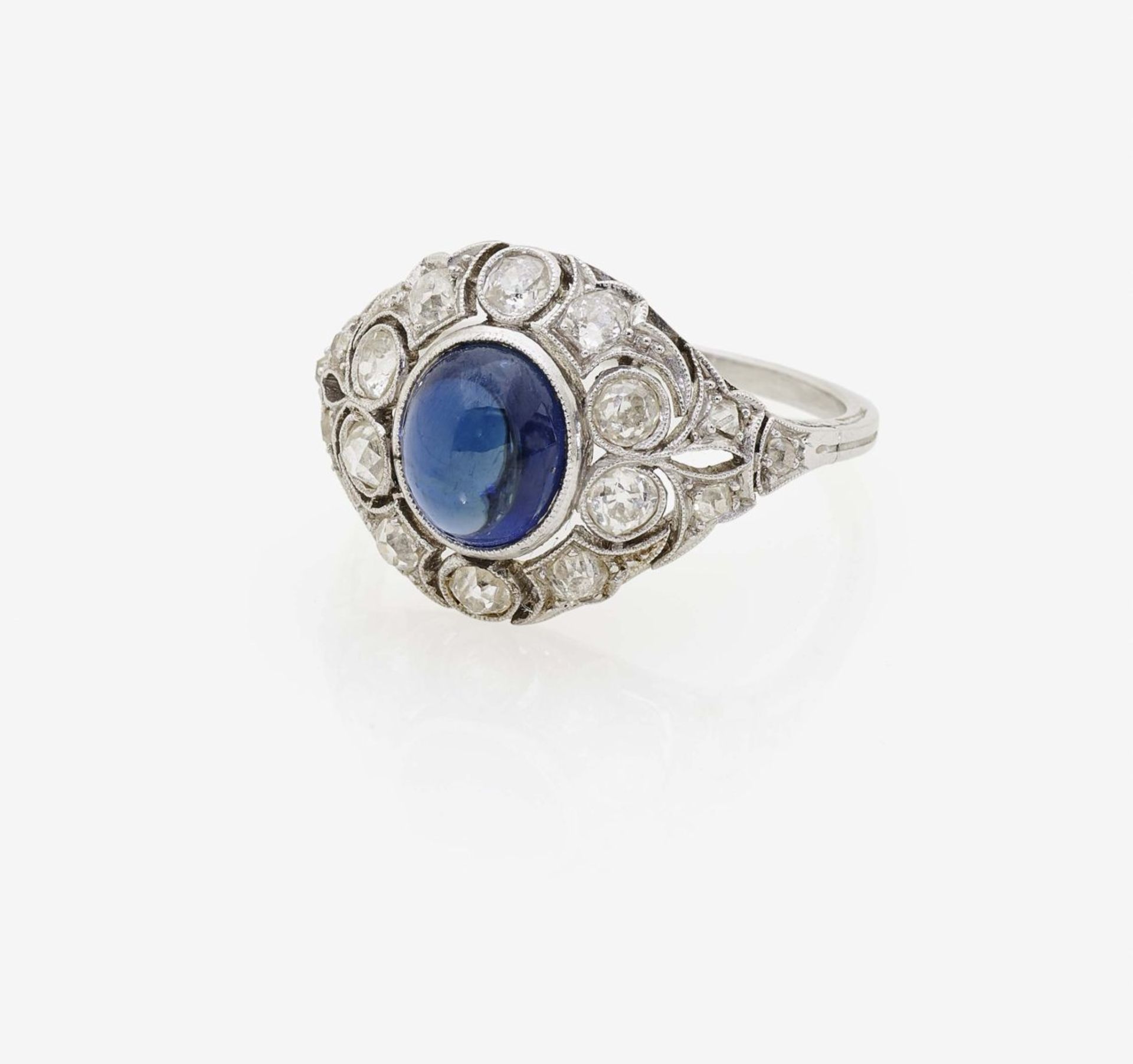 A Sapphire and Diamond RingGermany, circa 1915 Platinum, tested. 16 diamonds in various old-cuts,