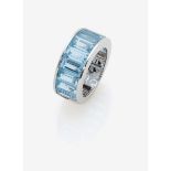 A Blue Topaz Half Eternity Ring18k white gold (750/-), stamped. Maker's marks DGR. 10 baguette-cut