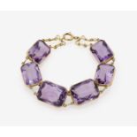 An Amethyst BraceletUSA, 1930s-1940s 14K yellow gold (585/-), stamped. 6 scissor-cut amethysts,