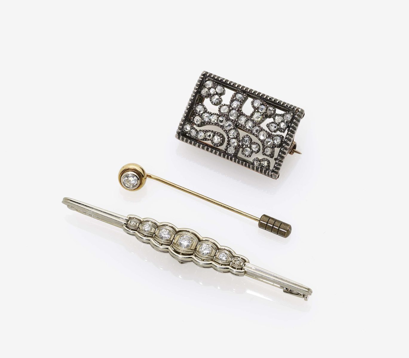 Two Brooches and A Tie Pin with DiamondsGermany, circa 1880 and 1930s 14K white gold (585/-) and 18K