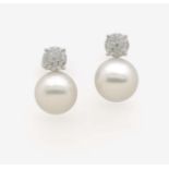 A Pair of South-Sea Cultured Pearl and Diamond Ear Studs18K white gold (750/-), stamped. 38 small,