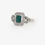 An Emerald and Diamond Ring18K white gold (750/-), stamped. 32 octagonal-cut and 2 baguette-cut