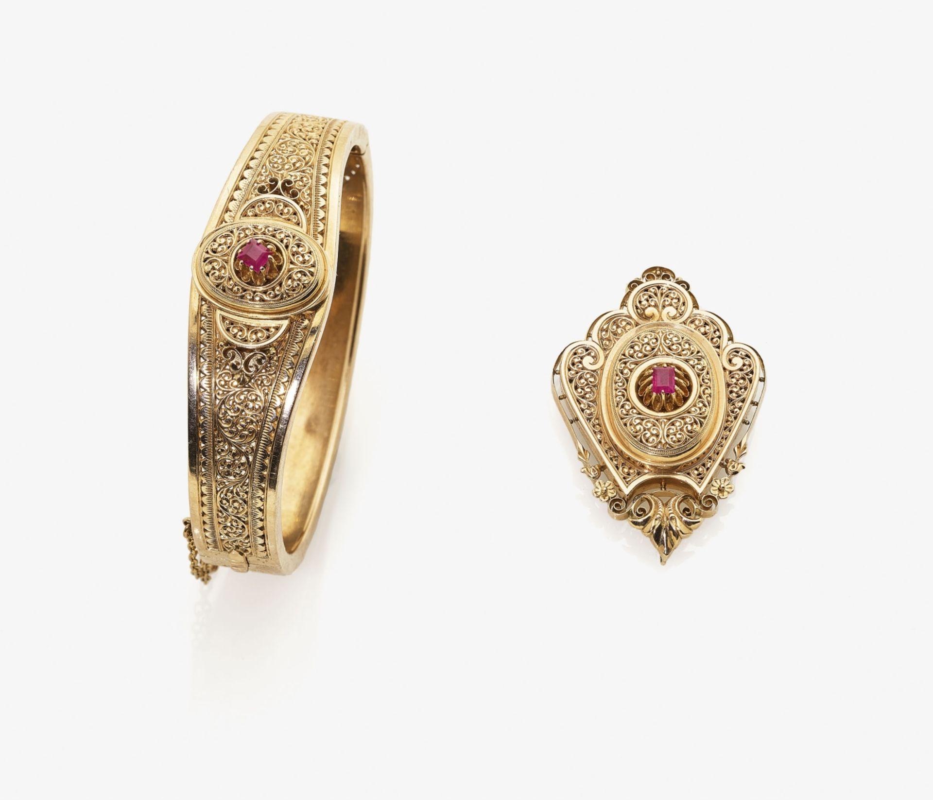 A Bangle and a PendantRussia, circa 1880 14K red gold (585/-), stamped. 2 rectangular rubies,