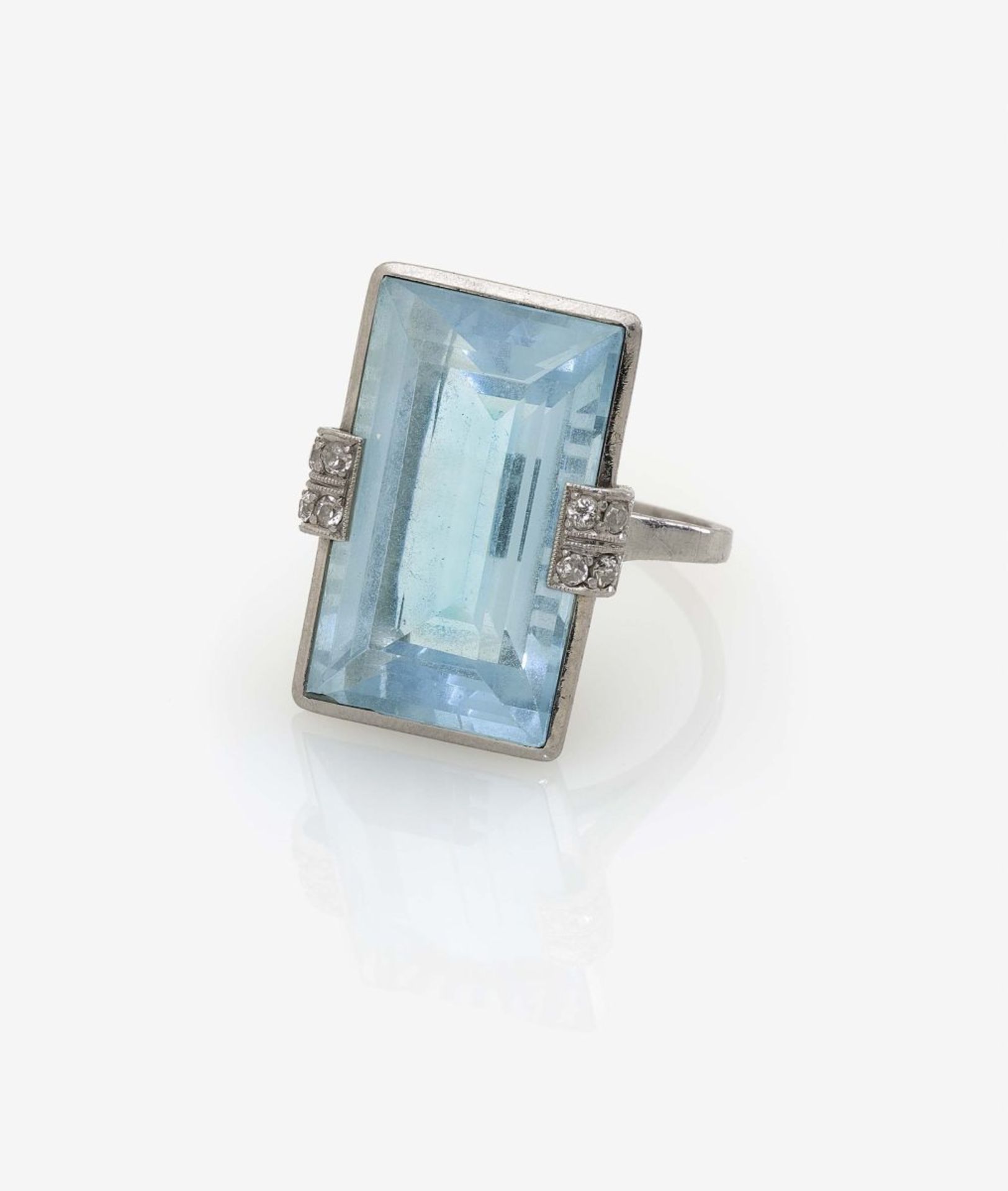 Aquamarine RingGermany, 1930s Platinum, inscribed. 8 small diamonds. 1 step-cut aquamarine, circa 14