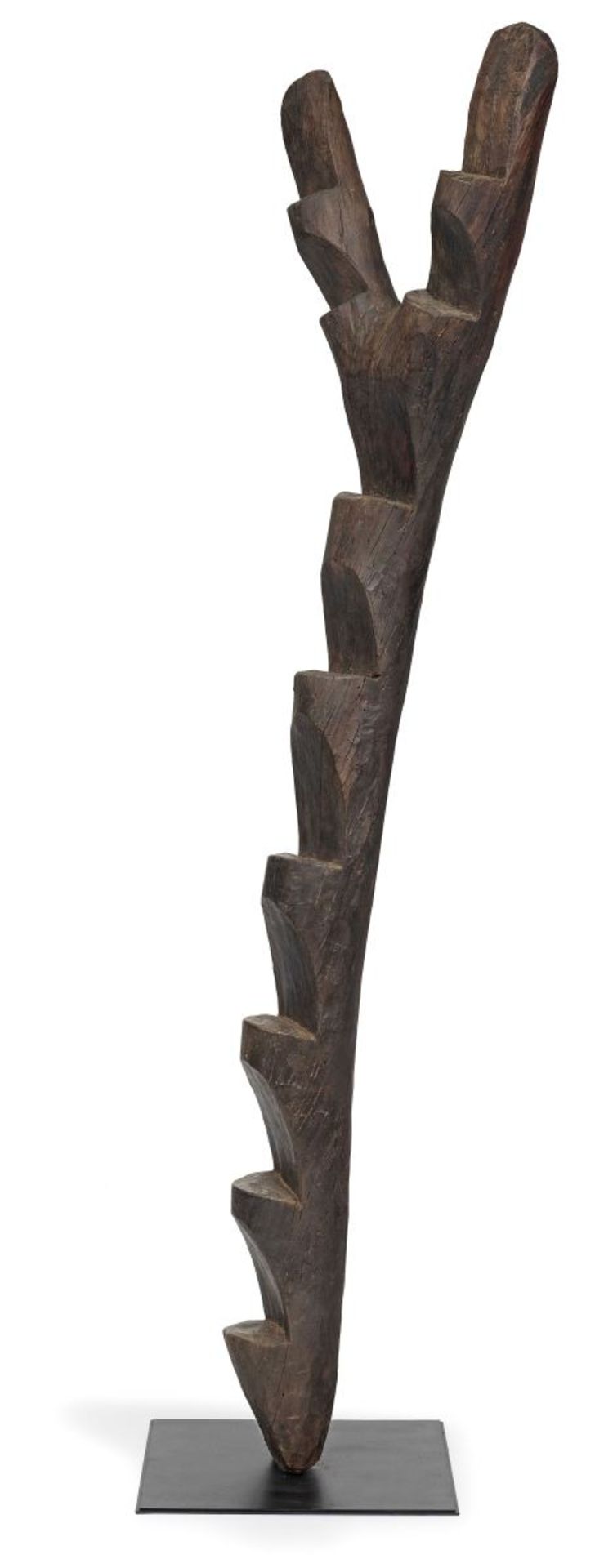 Dogon, MaliTree Ladder. Wood with dark brown patina. Metal pedestal plate. Height 250 cm.DOGON, MALI
