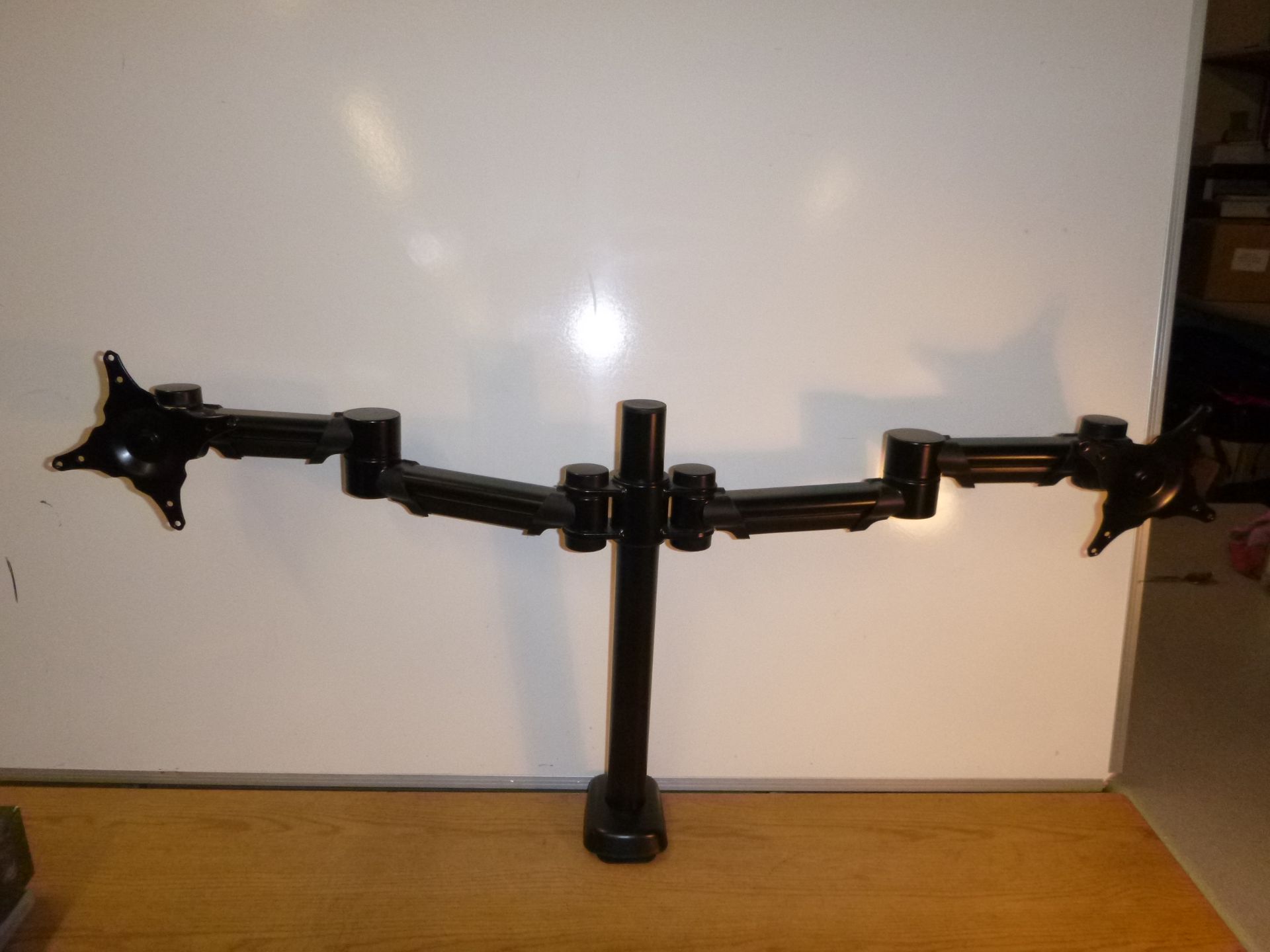 2 ARM MONITOR STAND. VERY SUBSTANTIAL METAL CONSTRUCTION. MULTI ADJUSTABLE. DESKTOP, SHELF OR