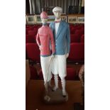 A large ceramic statue of an Art Deco style golfin