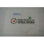 A Dubai Duty Free Irish Open white flag, signed in