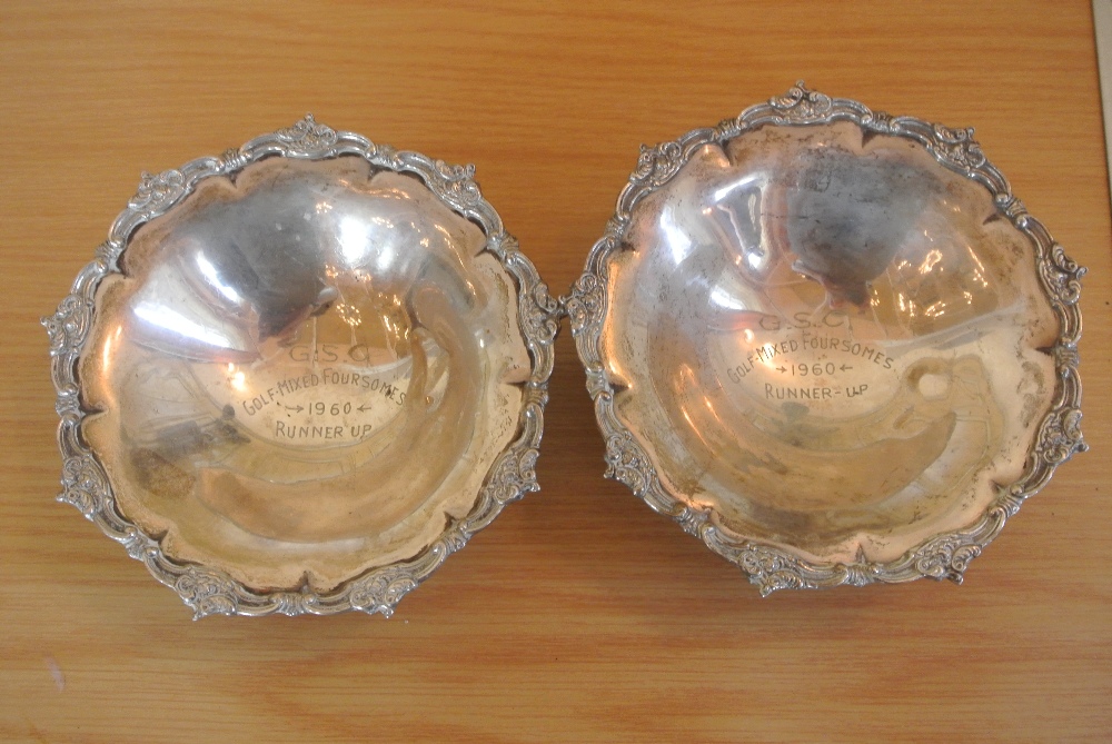 A pair of decorative silver plated bon bon dishes,