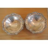 A pair of decorative silver plated bon bon dishes,