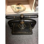 A Lion Brand cast iron book press, faux marble detailing in gilt, mark of crest of a lion over D,