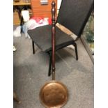 A copper bed warming pan on turned wood handle, 104cm max