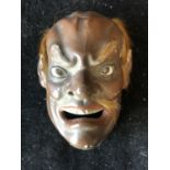 A Japanee noh mask, painted finish with fur features and glass eyes, 12 cm max