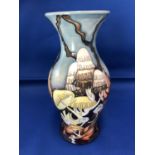 Vicky Lovatt for Moorcroft Pottery - A Lionshield pattern baluster shape vase, tubelined with