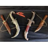 Four modern middle eastern decorative daggers, 32.5cm max (4)