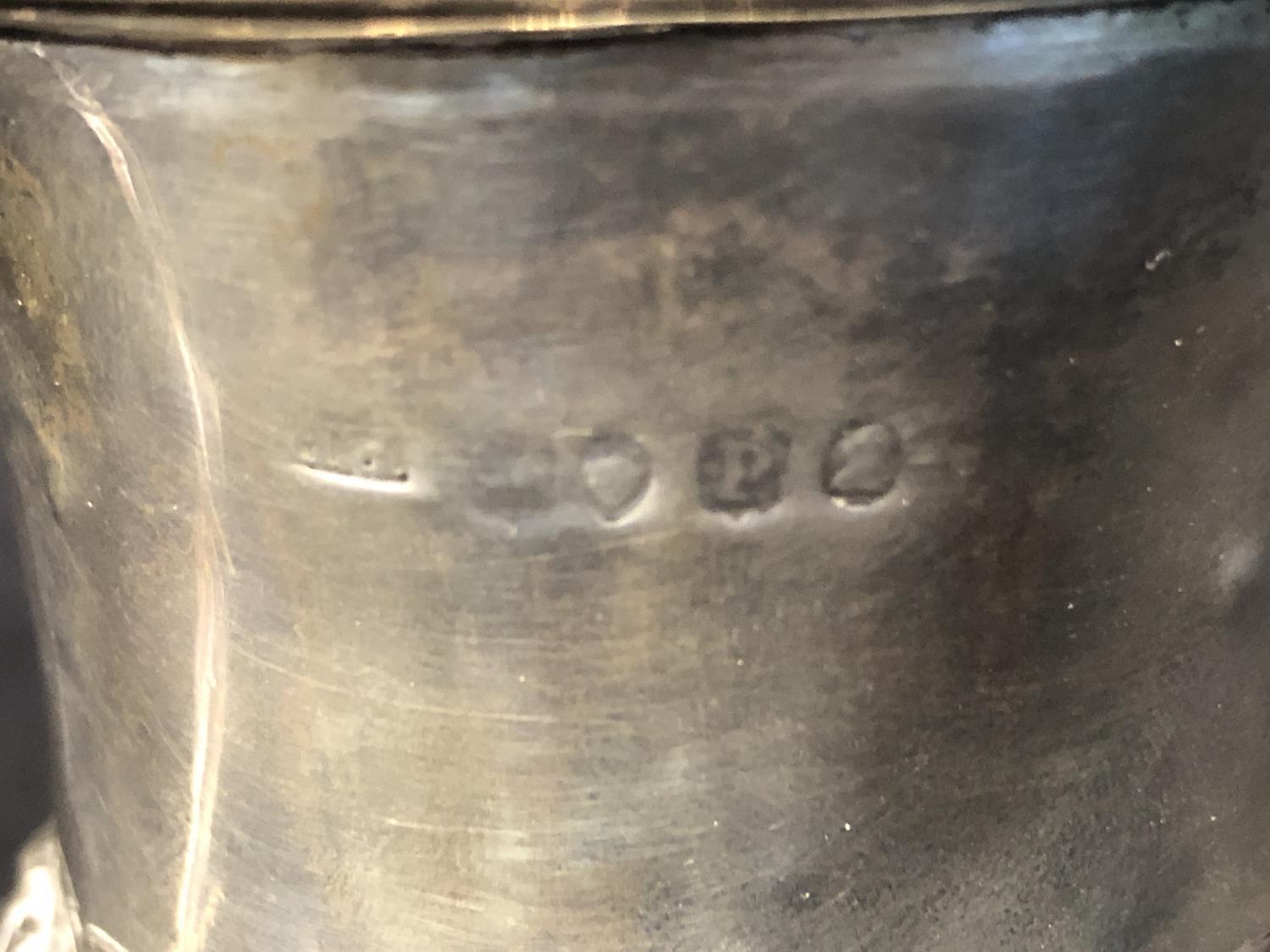 A Georgian silver small mug, the bell form body applied with serpent 's' scroll handle and on - Image 5 of 7