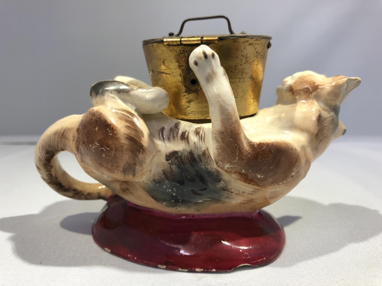 A Georges Dreyfus pottery novelty ink well, formed as a kitten on its back playing with a cooking - Image 6 of 8