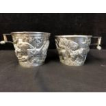 Two reproduction Ancient Greek silver Vaphio cups, of tapered cylindrical form with spool handle,