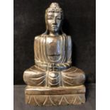 A decorative carved wood Buddha, seated on demi lune base carved as a lotus flower, modern, 49cm