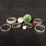 Eight white metal dress rings, mostly stamped 925, various designs including pearl and stone set (8)