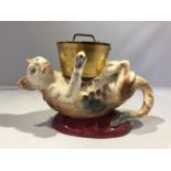 A Georges Dreyfus pottery novelty ink well, formed as a kitten on its back playing with a cooking