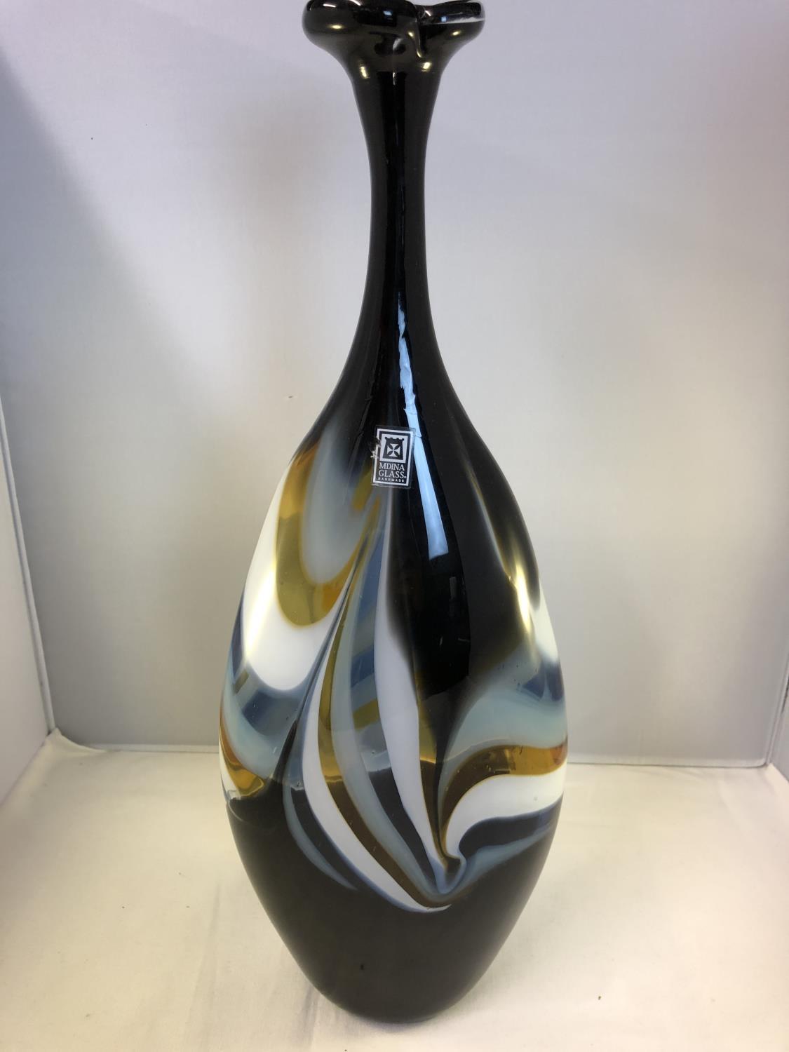 Mdina Glass - A large flattened bottle form vase, of amber, dark blue and white colour, original