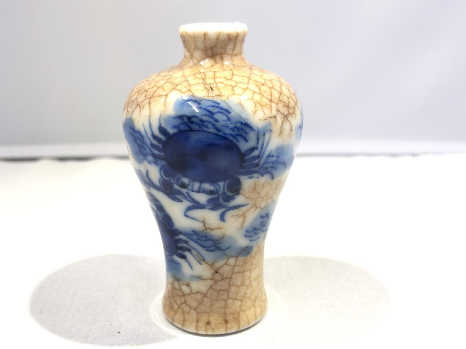 A miniature Chinese porcelain mei-ping shape vase, decorated with Happy Crabs in underglaze blue