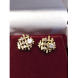 A pair of 1970's 9ct yellow gold modernist earrings, set with cubic zirconia (2)