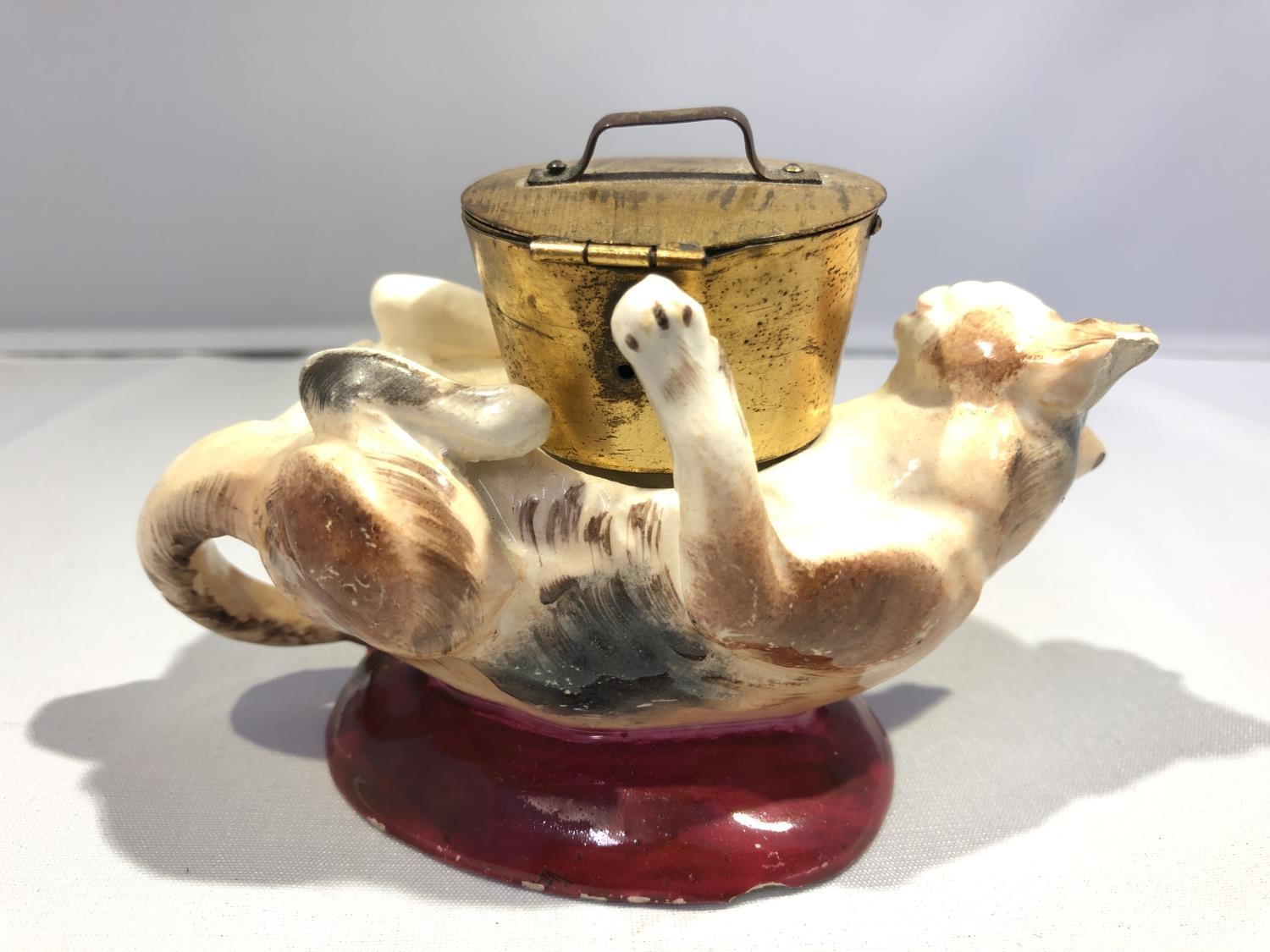 A Georges Dreyfus pottery novelty ink well, formed as a kitten on its back playing with a cooking - Image 7 of 8