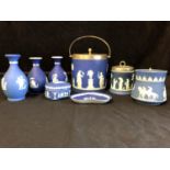 Eight items of Wedgwood blue dipped Jasper, comprising biscuit barrel; three vases, pin tray, and