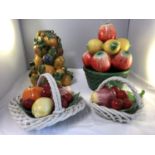 Four Mid Century Italian pottery fruit centerpieces, two arranged within white work baskets, one
