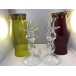 Two glass candle shades, in green and red, metal swag applique to upper rim; and two colourless