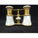 A pair of Colmont mother of pearl mounted brass case opera glasses, 9.5cm max