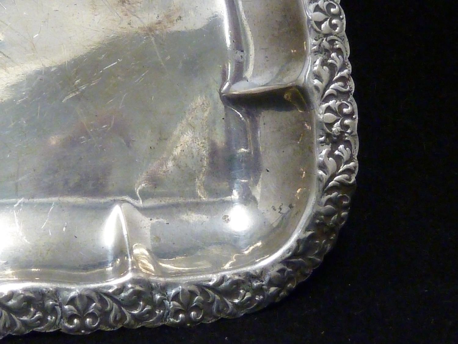 An Indian white metal charger, the central motif of a stylised duck like bird, within a band of - Image 14 of 15