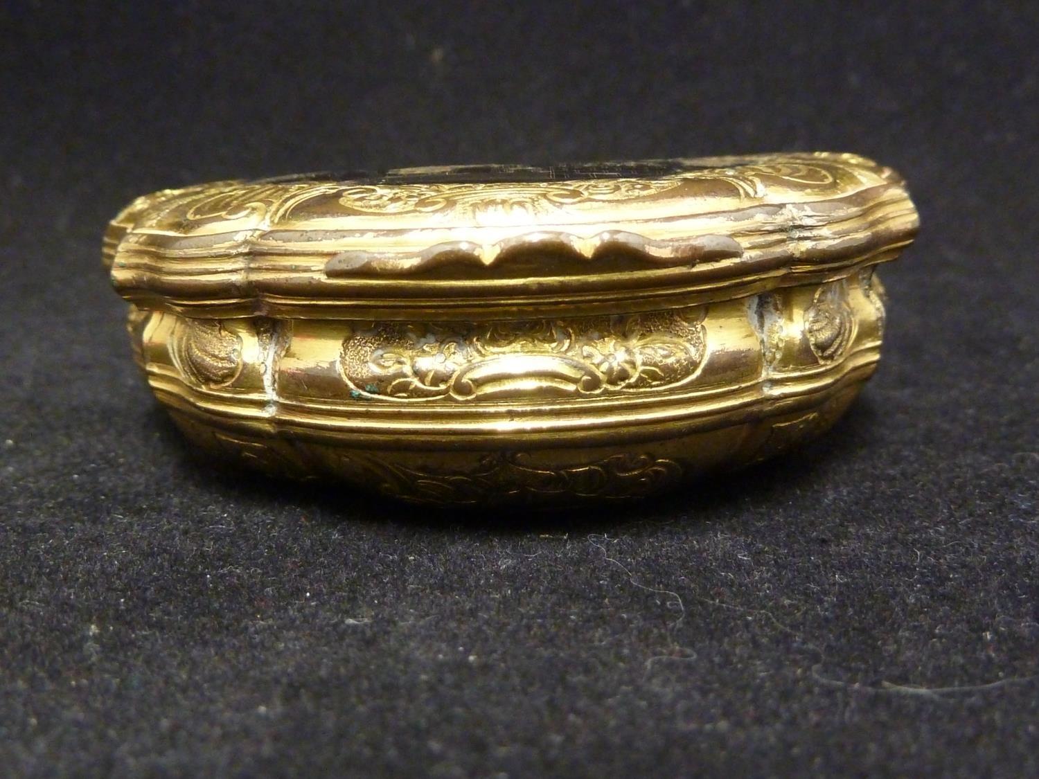 A gilt metal snuff box, in Louis XV style, of bombe form decorated with foliate scrolls and on three - Image 2 of 6