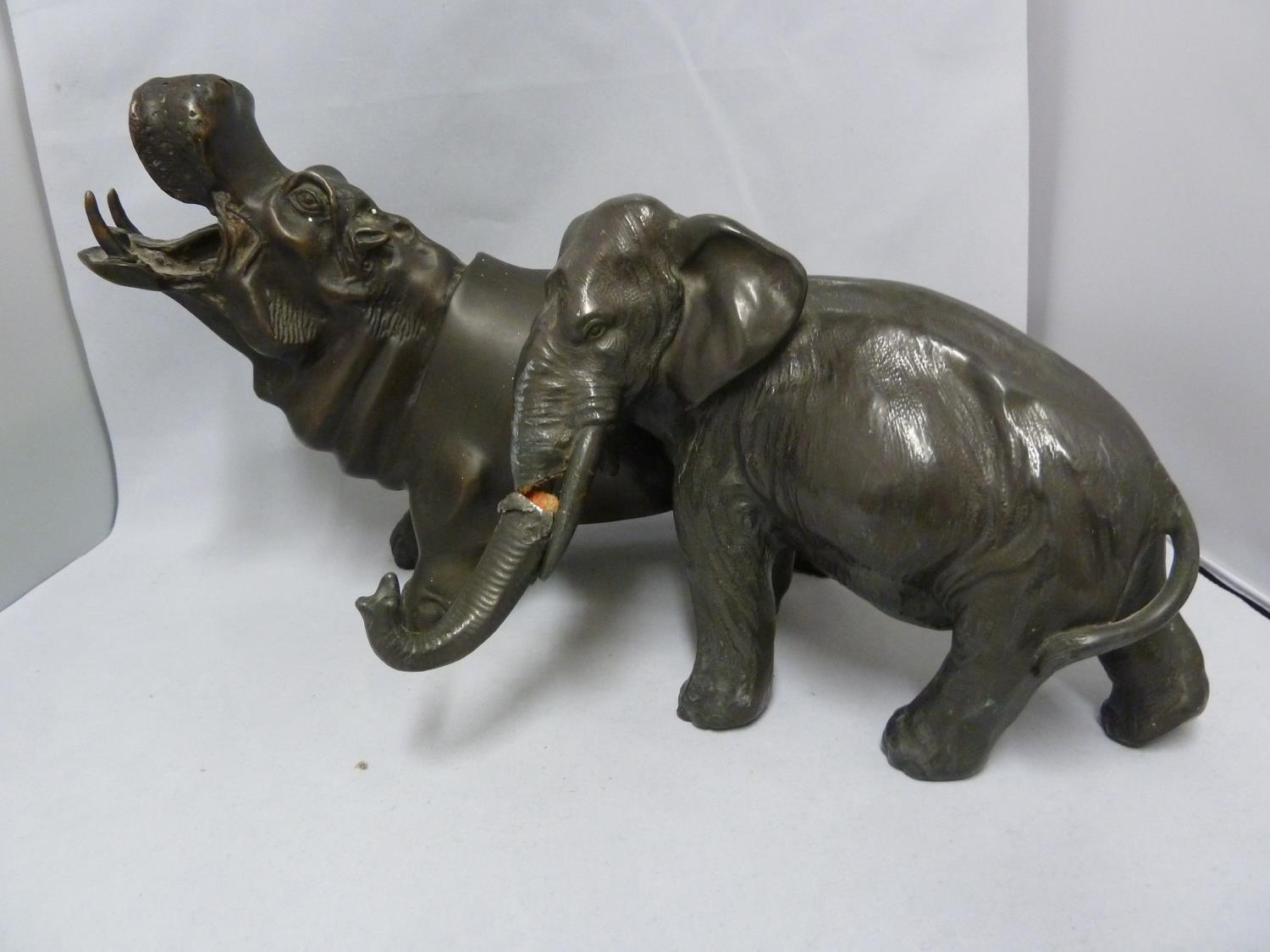 A bronzed metal figure of a Hippo; and a spelter figure of an elephant (2)