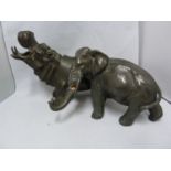 A bronzed metal figure of a Hippo; and a spelter figure of an elephant (2)