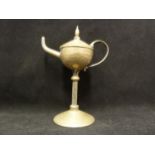 A WMF silvered brass table cigar lighter, of oil lamp form on tall stem, 18cm high