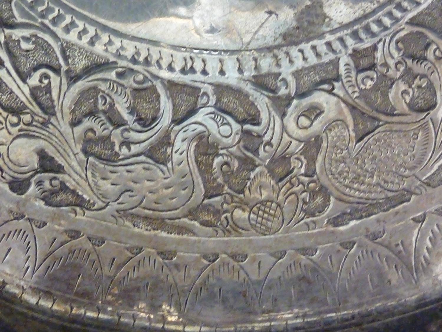 An Indian white metal charger, the central motif of a stylised duck like bird, within a band of - Image 5 of 15