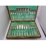 A cased set of Smith & Rait of Glasgow silver plated fish eaters, for 12 in fitted mahogany canteen;