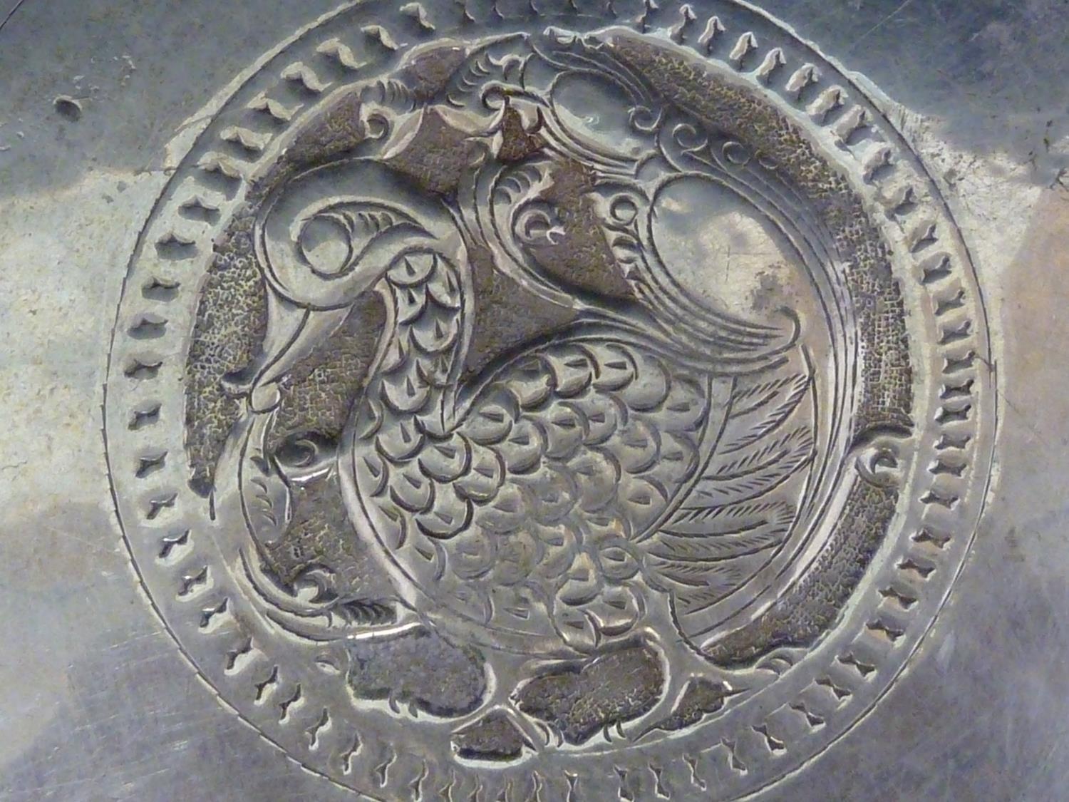 An Indian white metal charger, the central motif of a stylised duck like bird, within a band of - Image 4 of 15