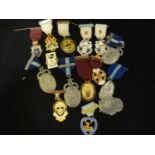 A group of 17 Masonic interest enamel and white metal medallions including a boxed Toye & Co Ltd