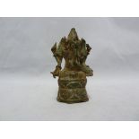 An indian bronze personal votive in the form of Ganesha, the elephant headed god seated on a lotus